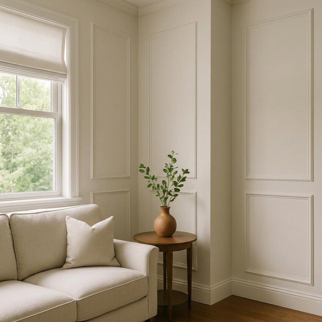 Picture-frame moulding wrapping a corner beside a window